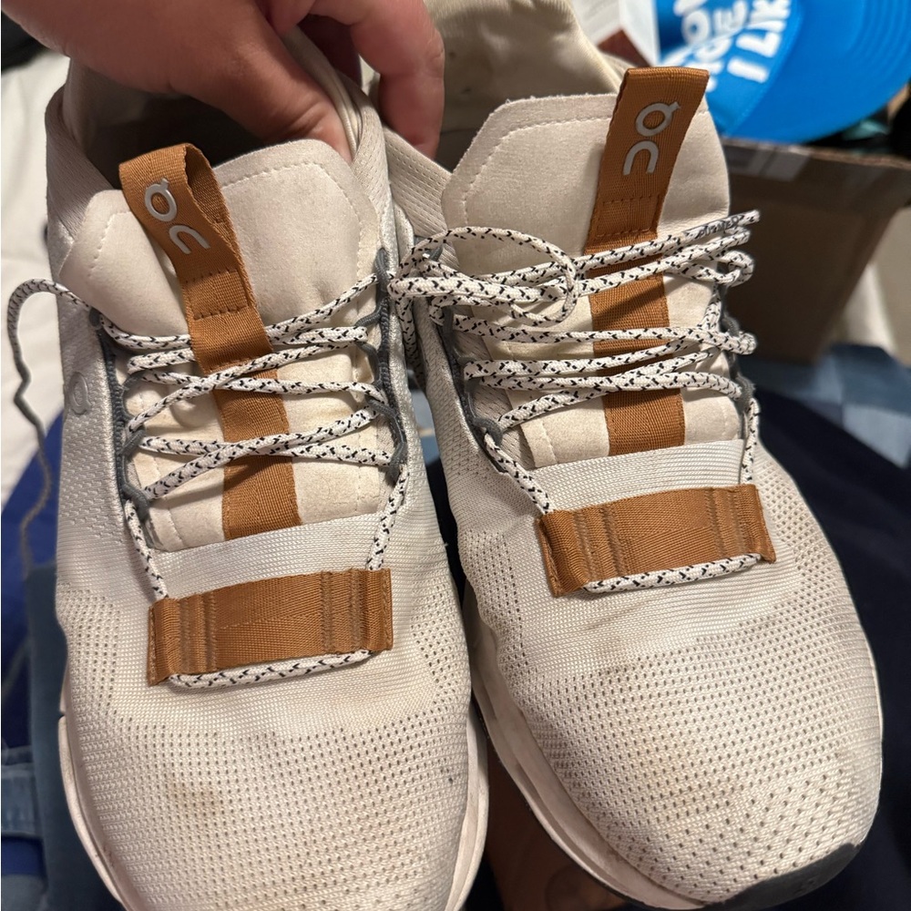 On Running Cream and Brown Sneakers